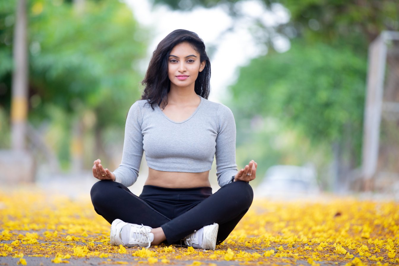 A Woman in Activewear Doing the Easy Pose